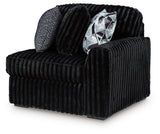 Ashley Furniture Midnight-Madness sectional sofa shown from an angled view, featuring plush cushions and modern design.