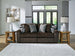Ashley Furniture Midnight-Madness sectional sofa with dark upholstery, plush cushions, and modern design, shown in a cropped image.