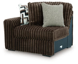 Ashley Furniture Midnight-Madness sectional sofa shown from an angled view, featuring plush cushions and modern design.
