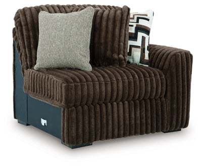 Ashley Furniture Midnight-Madness sectional sofa with plush cushions and modern design, shown from an angled view.
