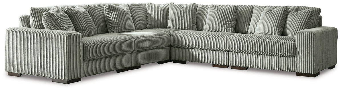 Ashley Furniture Lindyn sectional sofa with plush fabric and modern design, shown in a cozy living room setting.