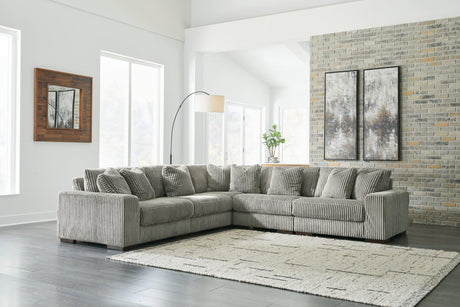 Ashley Furniture Lindyn sectional sofa with plush cushions and neutral fabric, shown in a modern living room setting.