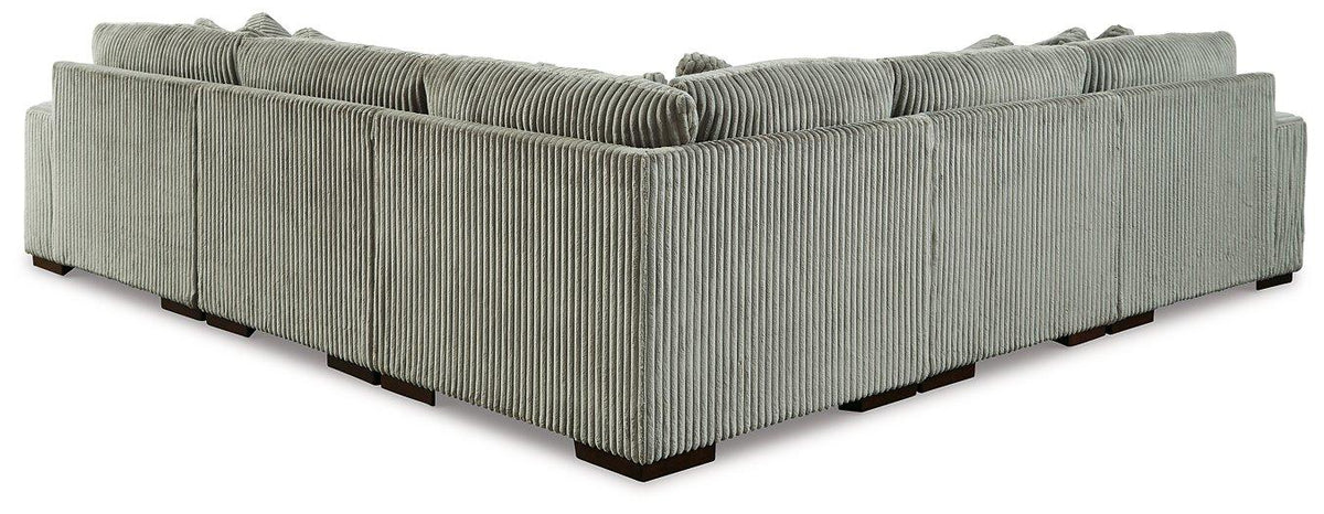 Ashley Furniture Lindyn sectional sofa with plush cushions and modern design, shown in a cozy living room setting.