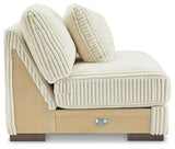 Ashley Furniture Lindyn sectional sofa with plush cushions and neutral fabric, designed for comfortable living room seating.