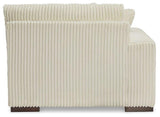 Ashley Furniture Lindyn sectional sofa with plush fabric, multiple cushions, and a modern design in a spacious living room setting.