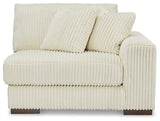 Ashley Furniture Lindyn sectional sofa with plush fabric and modern design, featuring multiple seating areas and a neutral color.