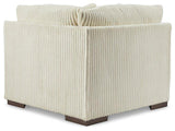 Ashley Furniture Lindyn sectional sofa with plush cushions and modern design, shown in a cozy living room setting.