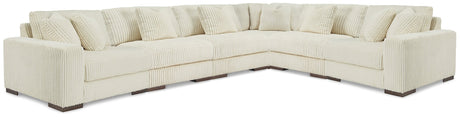 Ashley Furniture Lindyn sectional sofa with neutral fabric, featuring multiple cushions and a modern, spacious design.