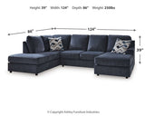 Ashley Furniture Albar Place sectional sofa with plush cushions and neutral fabric, shown in a modern living room setting.