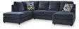 Ashley Furniture Albar Place sectional sofa with plush cushions and modern design, shown in a spacious living room setting.