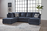 Ashley Furniture Albar Place sectional sofa with plush cushions and modern design, shown in a cozy living room setting.
