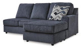 Ashley Furniture Albar Place Sectional sofa with plush cushions and modern design in a cozy living room setting.