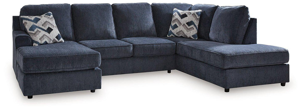 Ashley Furniture Albar Place sectional sofa with plush cushions and modern design, shown in a spacious living room setting.