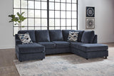Ashley Furniture Albar Place sectional sofa with plush cushions and modern design, shown in a spacious living room setting.
