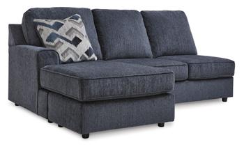 Ashley Furniture Albar Place sectional sofa with plush cushions and modern design in a cozy living room setting.