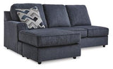 Ashley Furniture Albar Place sectional sofa with plush cushions and modern design in a cozy living room setting.