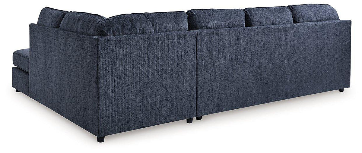 Ashley Furniture Albar Place sectional sofa showing neutral fabric upholstery and modern sectional design.