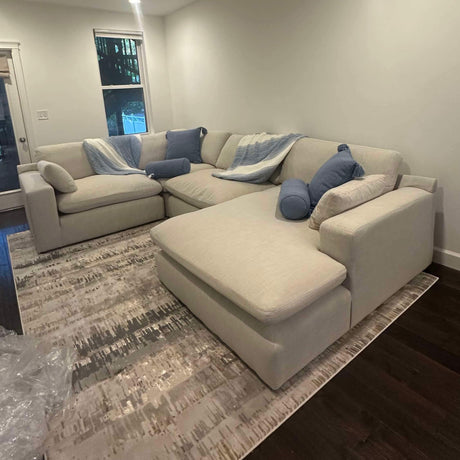 Ashley Furniture Atlas Cloud 4-piece sectional with left-facing chaise, featuring plush cushions and modern corner design.