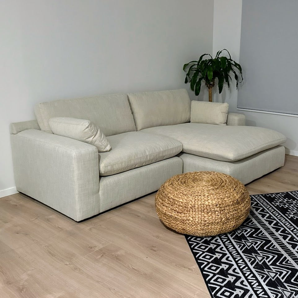 Ashley Furniture Atlas Cloud sectional with chaise, 2-piece fabric sofa set showing plush cushions and left-facing chaise.