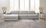 Ashley Furniture Amiata sectional with chaise, showing a modern fabric sofa with plush cushions and a spacious chaise lounge.