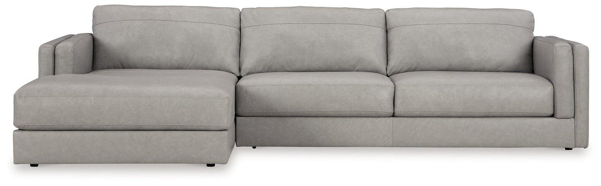 Ashley Furniture Amiata sectional with chaise, featuring plush fabric upholstery and modern design, shown in a stylish living room setting.
