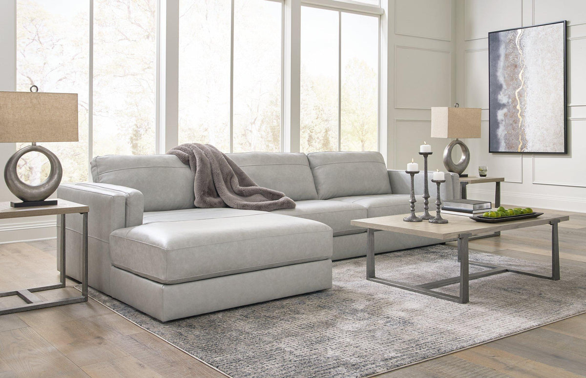 Ashley Furniture Amiata sectional with chaise, featuring plush cushions and modern design for comfortable living room seating.