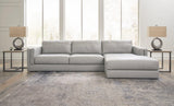 Ashley Furniture Amiata sectional with chaise, showing plush fabric upholstery and modern design in a spacious living room setting.