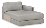 Ashley Furniture Amiata sectional with chaise, showing plush fabric upholstery and modern design in a spacious living room setting.