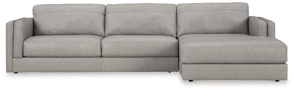 Ashley Furniture Amiata sectional with chaise, featuring plush fabric upholstery and modern design, shown in a spacious living room setting.