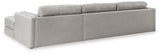 Ashley Furniture Amiata sectional with chaise, showing plush fabric upholstery and modern design in a spacious living room setting.