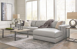 A Ashley Furniture Amiata sectional with chaise featuring plush cushions and modern design in a cozy living room setting.