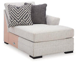 Ashley Furniture Koralynn sectional with chaise showing plush fabric upholstery and modern design in a cozy living room setting.