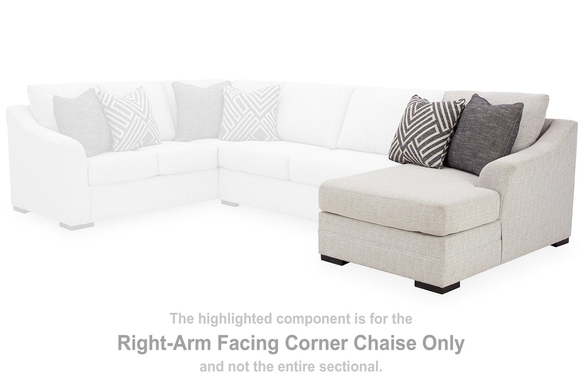 Ashley Furniture Koralynn sectional with chaise, beige fabric, modern design, featuring plush cushions and a spacious seating area.