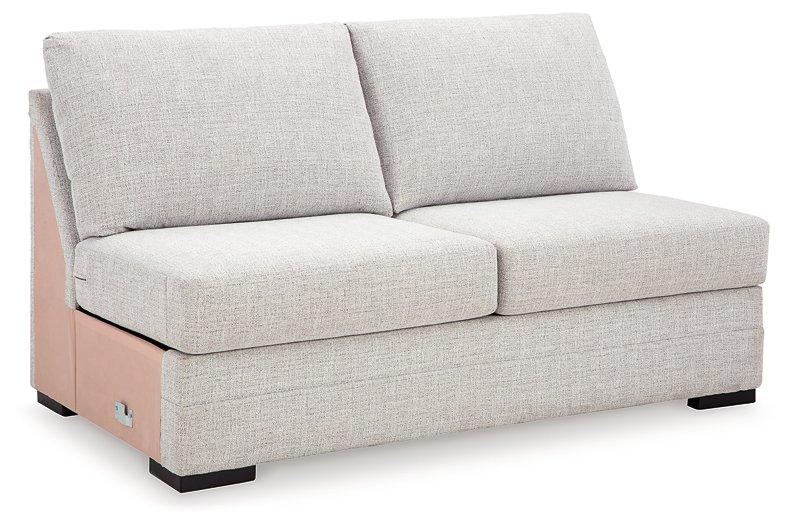 Ashley Furniture Koralynn sectional with chaise, showcasing a modern fabric sofa with a spacious chaise lounge and plush cushions.