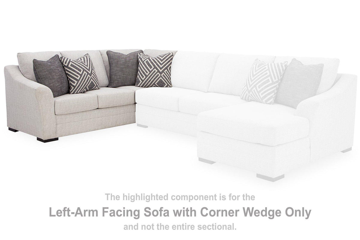 Ashley Furniture Koralynn sectional with chaise, showing a modern fabric sofa with plush cushions and a spacious chaise lounge.