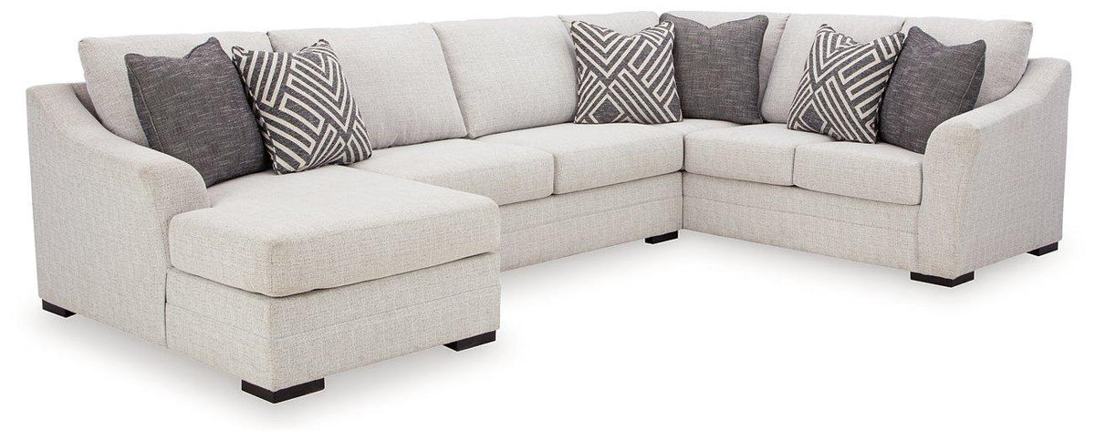 Ashley Furniture Koralynn sectional with chaise, featuring plush cushions and modern design, shown in a cozy living room setting.