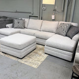 Ashley Furniture Koralynn sectional with chaise, featuring plush cushions and neutral fabric for a modern living room look.