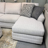 Ashley Furniture Koralynn sectional with chaise, showing a modern fabric sofa with plush cushions and extended chaise lounge.