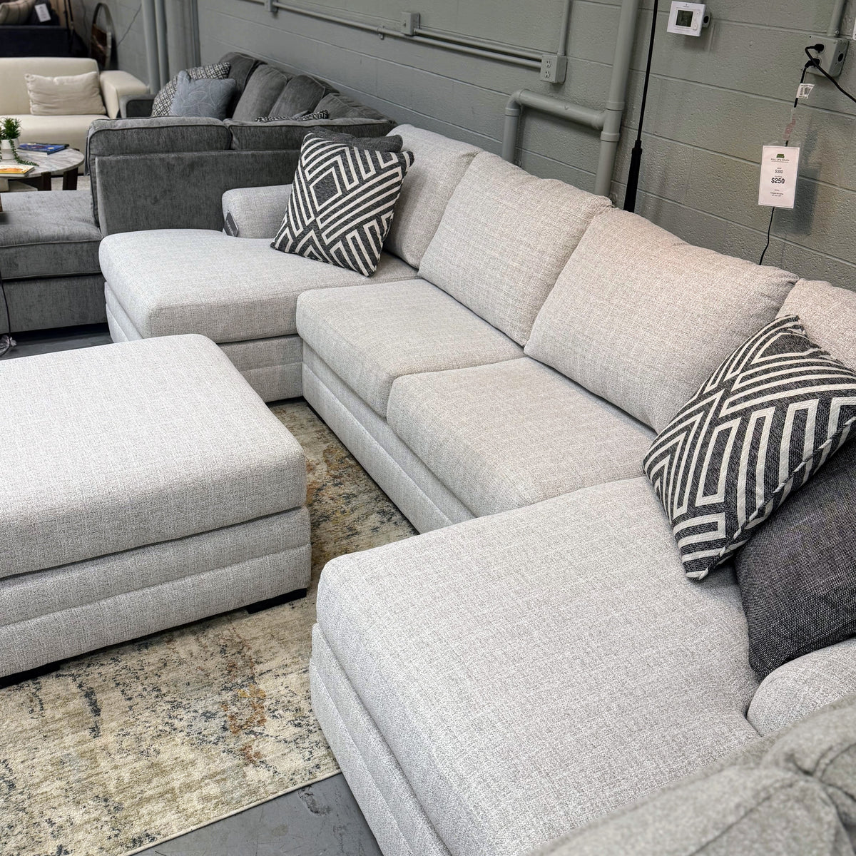 Ashley Furniture Koralynn sectional with chaise, featuring plush fabric and modern design, shown in a cozy living room setting.