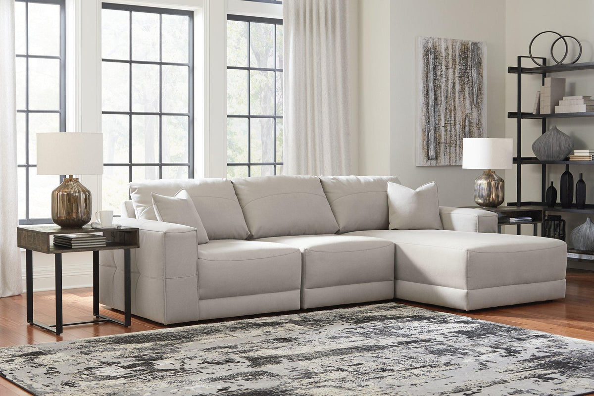 Next-Gen Gaucho Sectional Sofa with Chaise by Ashley Furniture, showcasing plush upholstery and modern design in a spacious living room setting.