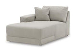 Ashley Furniture Next-Gen Gaucho sectional sofa with chaise, featuring plush cushions and modern design in a spacious living room setting.
