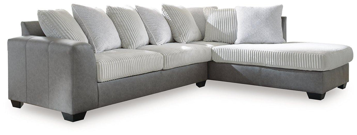 Ashley Furniture Clairette sectional with chaise, featuring plush upholstery and modern design, shown in a spacious living room setting.