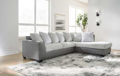 Ashley Furniture Clairette Court Sectional with chaise, beige fabric sofa with plush cushions and modern design.