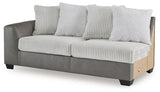 Ashley Furniture Clairette sectional with chaise, featuring plush fabric, modern design, and spacious seating arrangement.