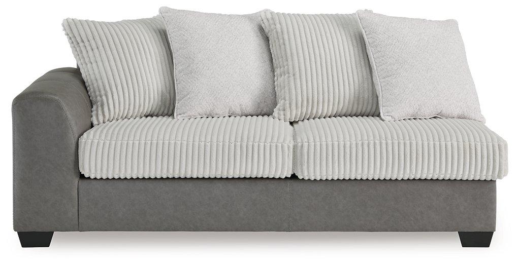 Ashley Furniture Clairette Court Sectional with chaise showing plush fabric and modern design in a spacious living room setting.