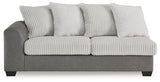 Ashley Furniture Clairette Court Sectional with chaise showing plush fabric and modern design in a spacious living room setting.