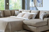Ashley Furniture Newellen Sleeper Sectional with Chaise, modern sectional sofa with chaise and fold-out bed, in neutral fabric.