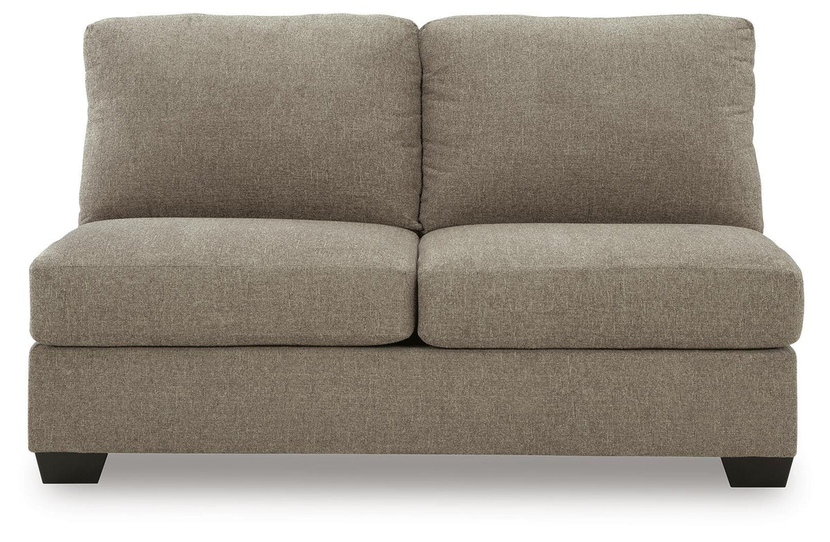 Ashley Furniture Newellen sleeper sectional with chaise, featuring plush cushions and modern design, shown from head-on angle.