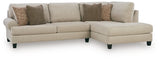 Ashley Furniture Steelwater Retreat sectional with chaise, featuring plush cushions and stylish upholstery for a modern living room.