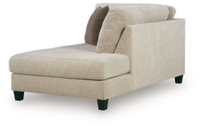 Ashley Furniture Steelwater Retreat sectional with chaise, showing a modern fabric sofa with plush cushions and a spacious chaise lounge.